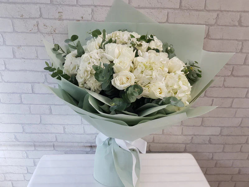 Hydrangeas, Roses & Eucalyptus Leaves By Flower Delivery Dubai for him