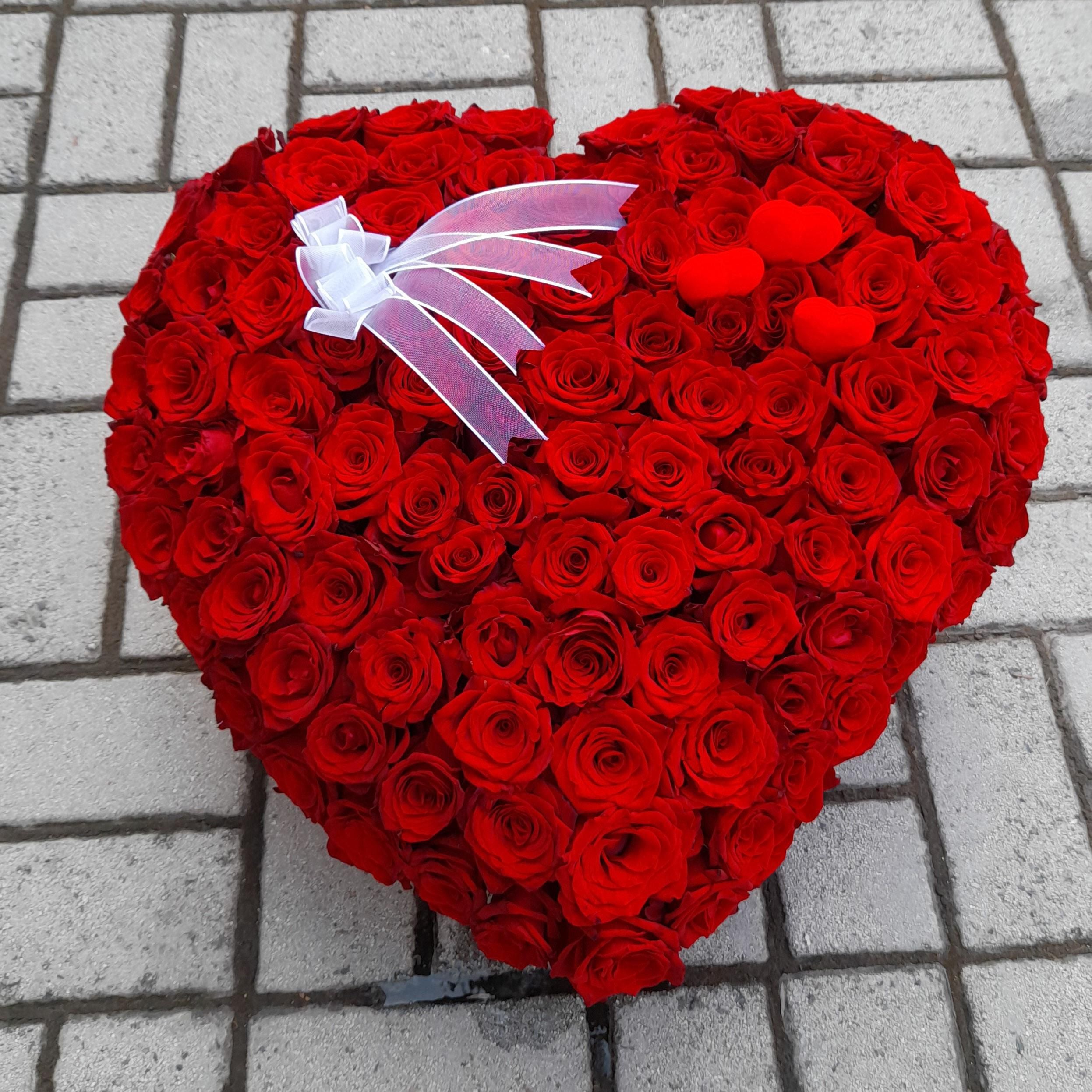 Close-up detail of one hundred and one roses in a heart-shaped box