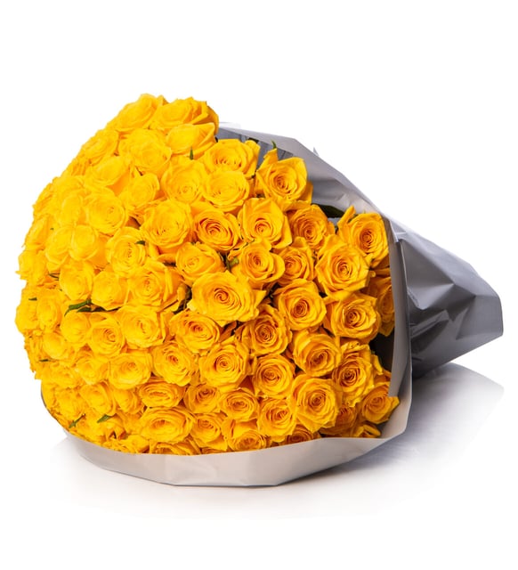 Close-up detail of one hundred and fifty yellow roses in grey wrapping