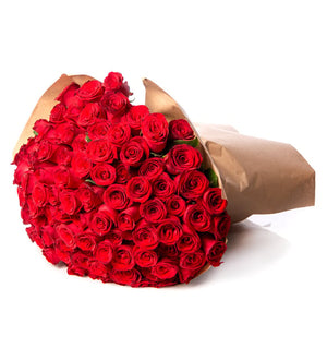 Two hundred red roses wrapped in craft paper, front view