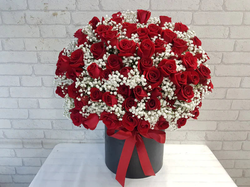 60 Roses & Baby’s Breath in Box By Flower Delivery Dubai for her