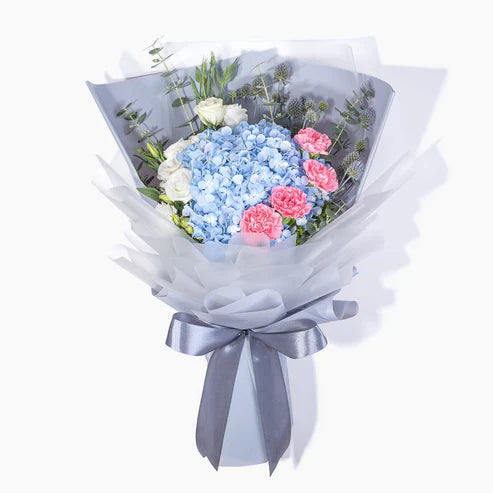 Hydrangeas, Carnations & Eustomas Wrapped By Flower Delivery Dubai for him