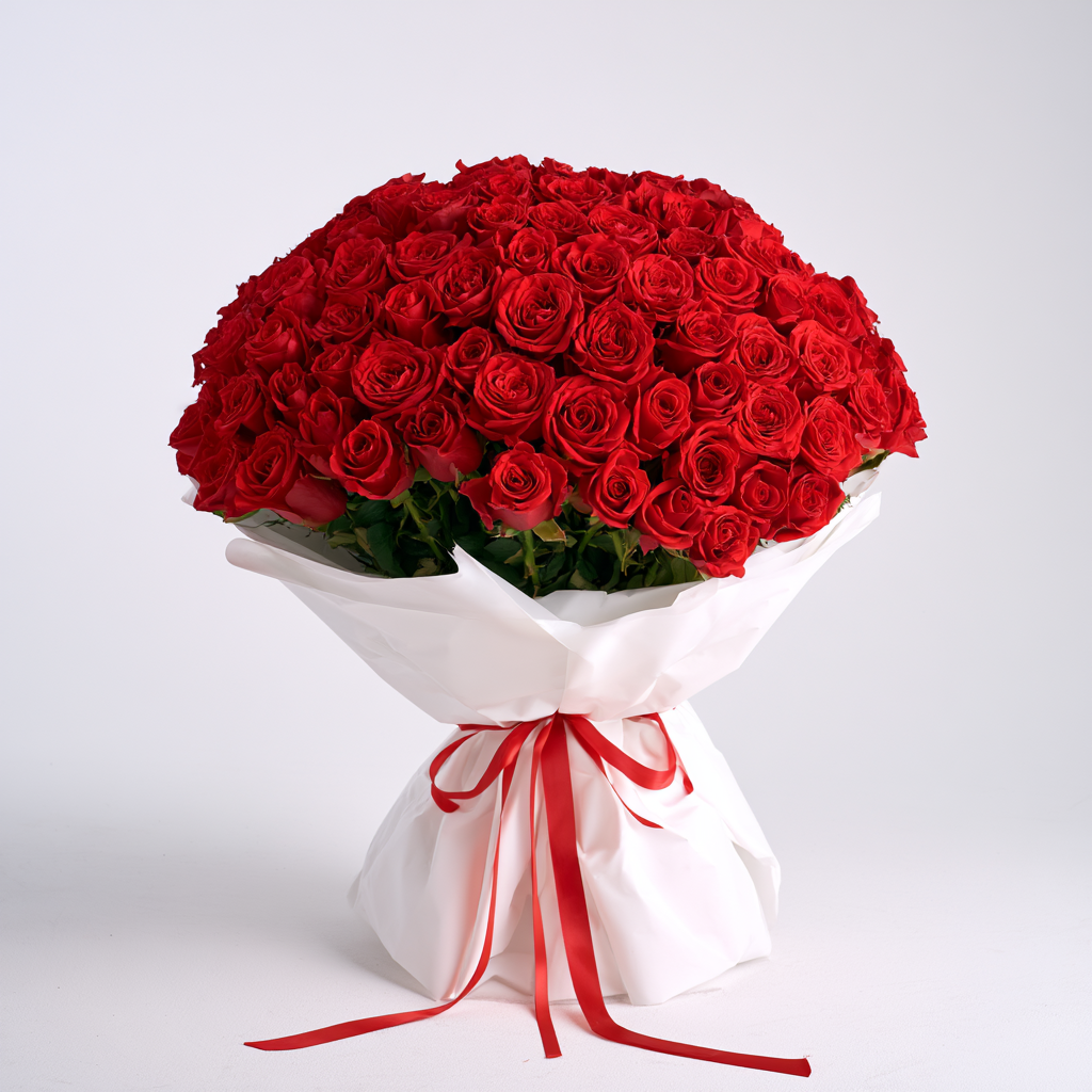 101 red roses in a white Korean-style wrap finished with a red satin ribbon — flower delivery in Dubai