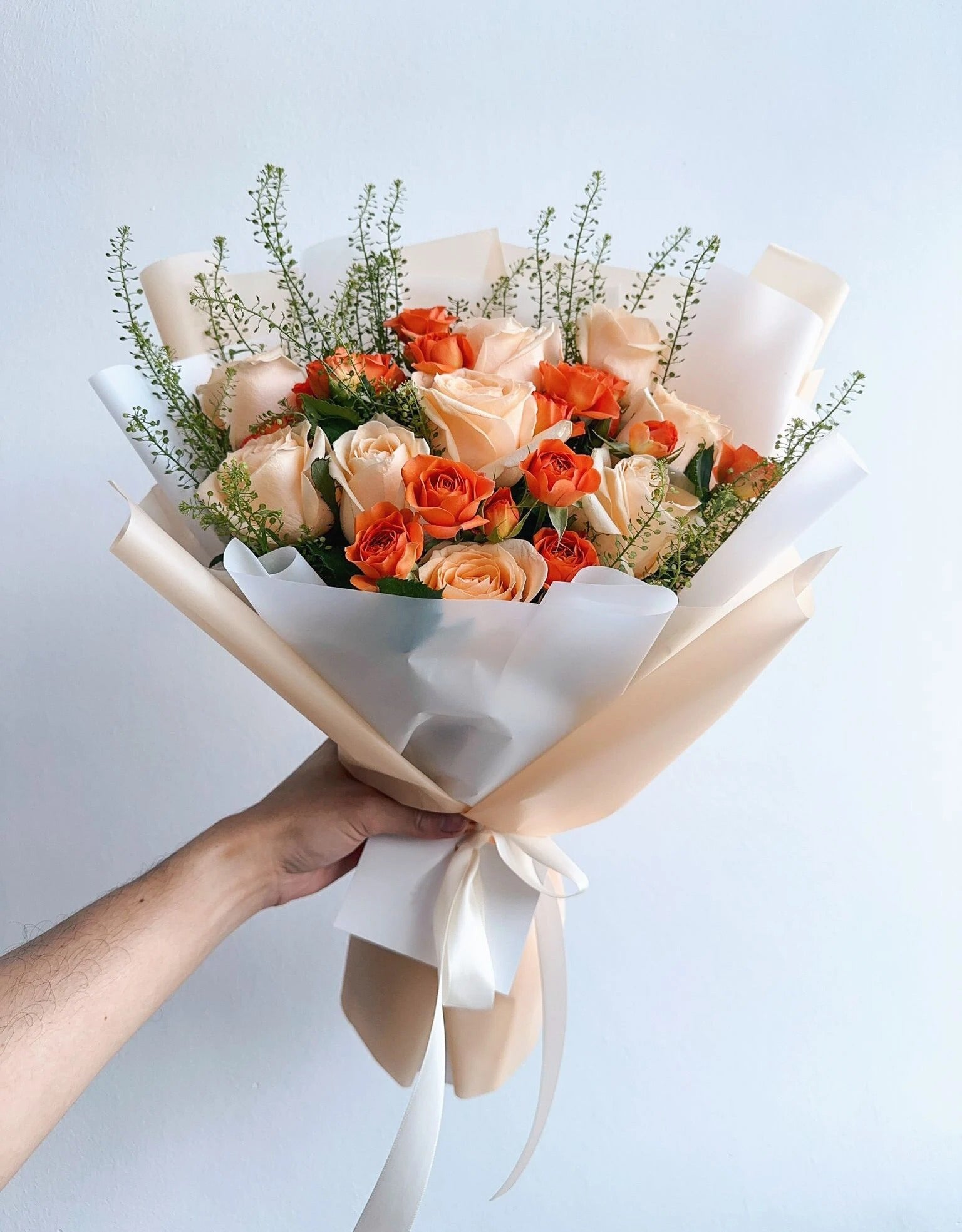 Orange Rose Spray & Champagne Roses with Green Bell By Flower Delivery Dubai for him