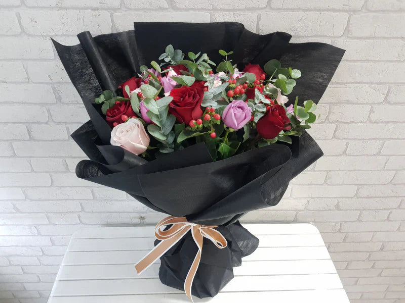 Roses, Red Berries & Eucalyptus Bouquet By Flower Delivery Dubai for her