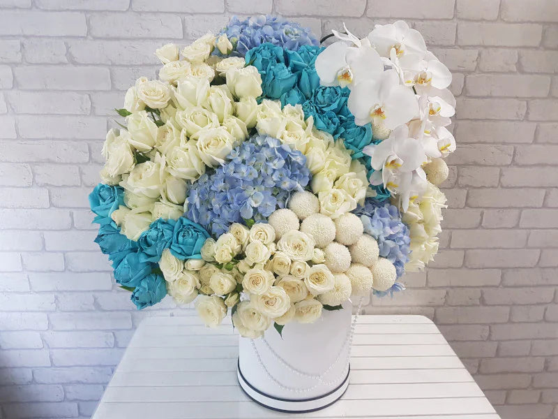 White Roses, Blue Roses & Phalaenopsis Bouquet By Flower Delivery Dubai for Wedding